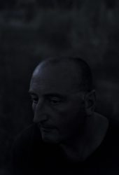 Somma Vesuviana(Na), Italy 2020 July 06 : Pierfrancesco Ammendola, 42 years old, posing in the field of Masseria Mele during the full moon night of July. He grew up   watching his father work in his family agriculture fields at San Giuseppe Vesuviano (Na) where his grandfather worked too. He grows native species of vegetables and fruits by practicing integrated agriculture. His mom works with him too in the transformation laboratory.