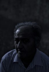 Somma Vesuviana(Na), Italy 2020 July 06 : Antonio Biondi, 63 years old, posing in the field of Masseria Mele during full moon night. He grew up watching his father and grandfather work as farmers farmers in their family fields at Alife (Ce), helping them since he was a child. He grows native species of vegetables, in particular, 'Alife's Onion' with natural agriculture. His wife, Concetta, works with him.